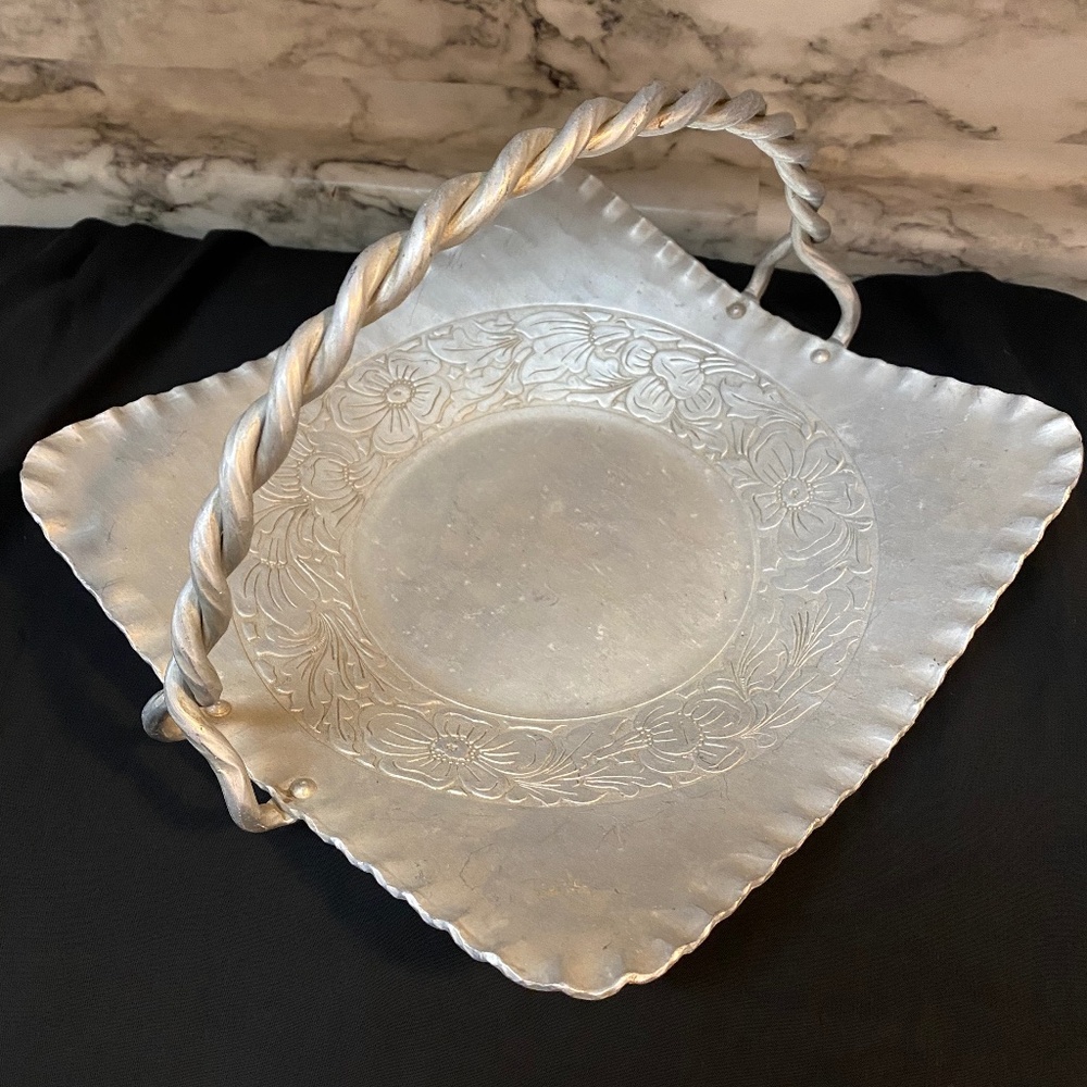 * hand-forged hammered aluminum basket engraved floral bouquet twisted handle
